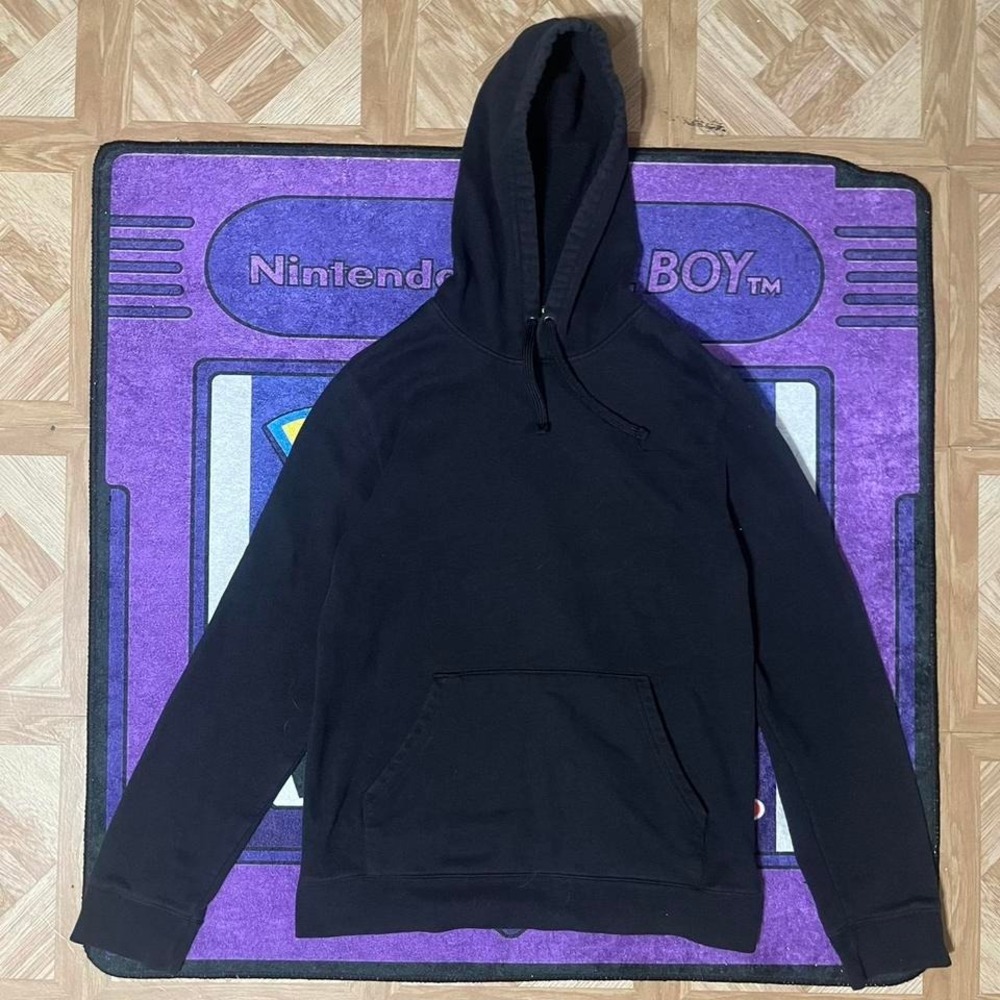 All Black hoodie with a relaxed fit, featuring a relaxed design